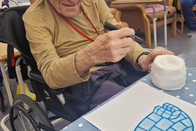 Residents showcase their imaginative designs after a themed arts and crafts session marking Polar Bear Day.