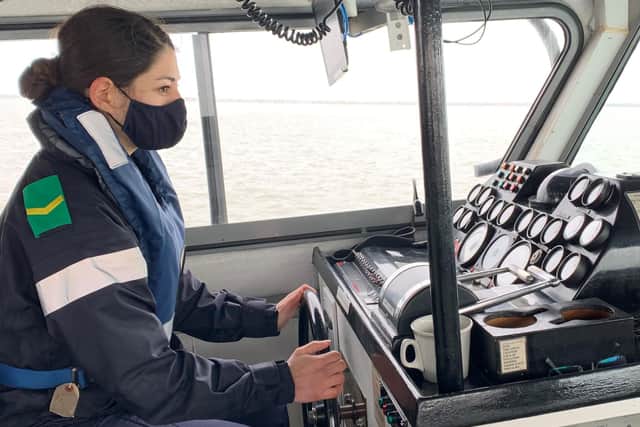 Raw recruits from HMS Collingwood pictured on HMS Sabre, one of two coastal patrol boats being used to provide the new sailors with the training at sea. Pictured is one of the recruits at the helm of one of the boats. Photo: Royal Navy