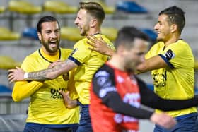 Christian Burgess, left, celebrates with his Royale Union Saint-Gilloise team-mates after scoring against RFC Seraing,  Picture:  LAURIE DIEFFEMBACQ/BELGA MAG/AFP via Getty Images