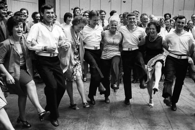 Workers at the Metal Box factory at Copnor introducing Russian sailors from the Soviet warship Obraztsovy to an English knees-up, 1976. Picture: The News PP5040
