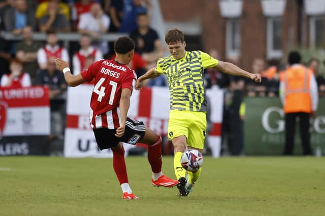 Former Pompey centre-half Sean Raggett encouraged Cohen Bramall to join John Mousinho’s men. Picture: Jim Brailsford