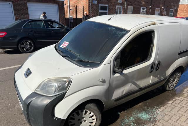 The van gutted by fire in Trafalgar Place, with several other vehicles target by arson in the early hours of the morning.