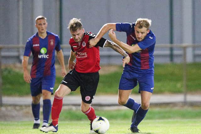 Ryan Smart, right, in action for US Portsmouth against Bournemouth Poppies. Picture: Chris Moorhouse