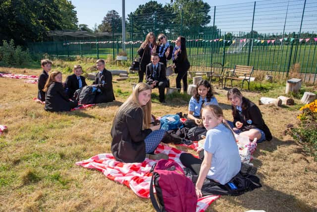 Pupils enjoying a green picnic at their sensory and art garden 
Picture: Habibur Rahman