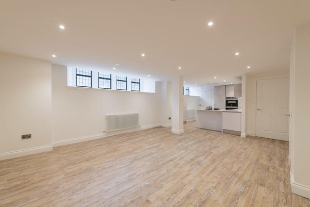 The apartment has a huge, open-plan living room, dining room and kitchen space.