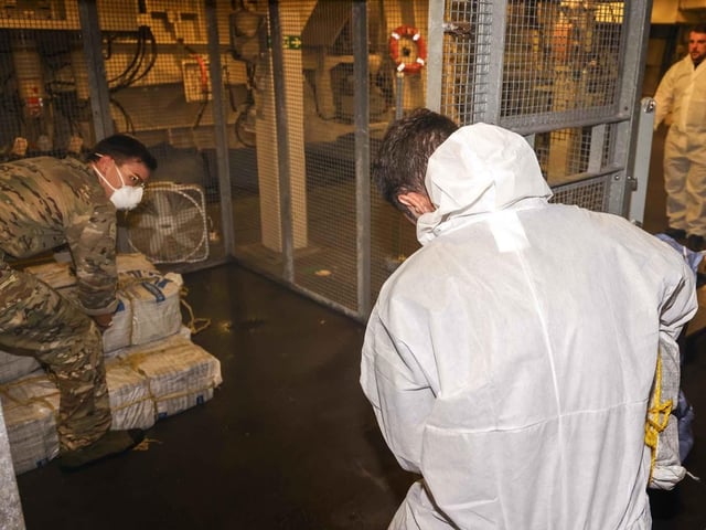 HMS Dauntless recovers bales of narcotics during a counter-interdiction operation in the Caribbean Sea.
