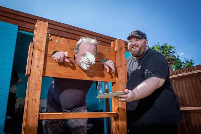 Darren Armistead with his son Connor playing with the stocks he built during lockdown. Picture: Habibur Rahman