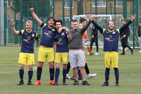 Pelham Arms players celebrate their win that took them to the top of the Division 5 table. Picture by Kevin Shipp