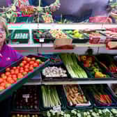 Co-owner of the business, Sue Ings, shows there is is no shortage of tomatoes at Ron White greencrocers, Marmion Road, Southsea. Picture: Chris Moorhouse (jpns 240223-25)
