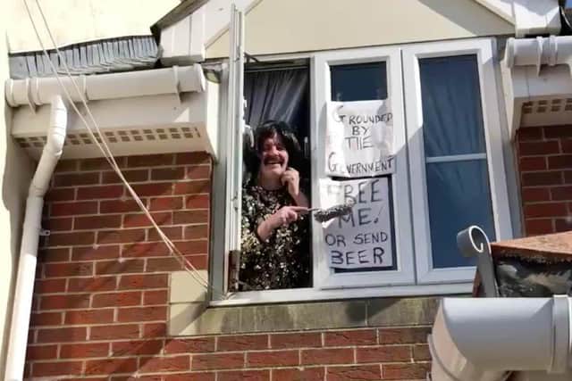 Martin Cormican sings Queen to entertain the neighbours whilst in isolation in Baffins, Portsmouth.