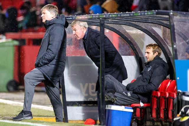 Kenny Jackett in the Cheltenham dugout - where he took his earnings in the EFL Trophy as Pompey boss to £540,000. Picture: Nigel Keene
