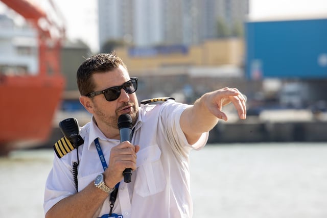 Pictured - Port Harbour Master Ben Mcinnes directing visitors as they arrived on the bus shuttles.

Photos by Alex Shute