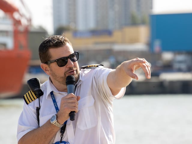 Pictured - Port Harbour Master Ben Mcinnes directing visitors as they arrived on the bus shuttles.
Photos by Alex Shute