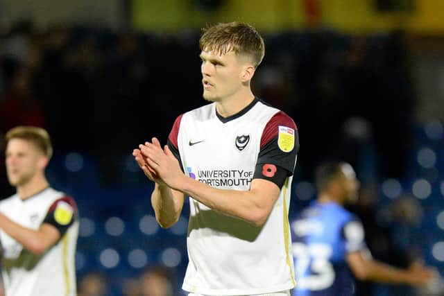Sean Raggett applauds the Fratton faithful at Wycombe on Saturday Picture: Graham Hunt