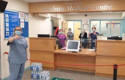 Staff at Southsea Medical Centre give the thumbs up after receiving donations of food and drinks.