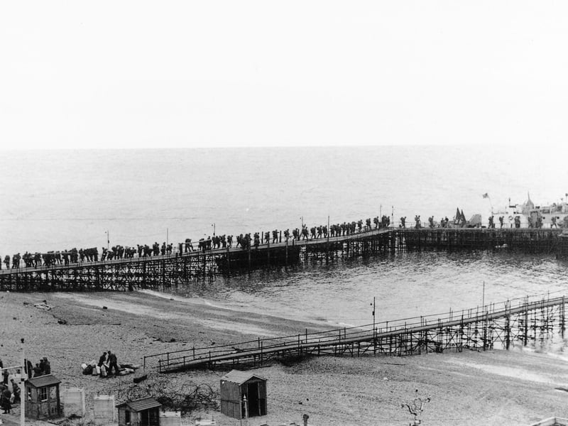 Troops, believed to be Royal Canadian Engineers, on board an LCI(L) alongside South Parade Pier, about to embark for Normandy. Probably after D-Day.