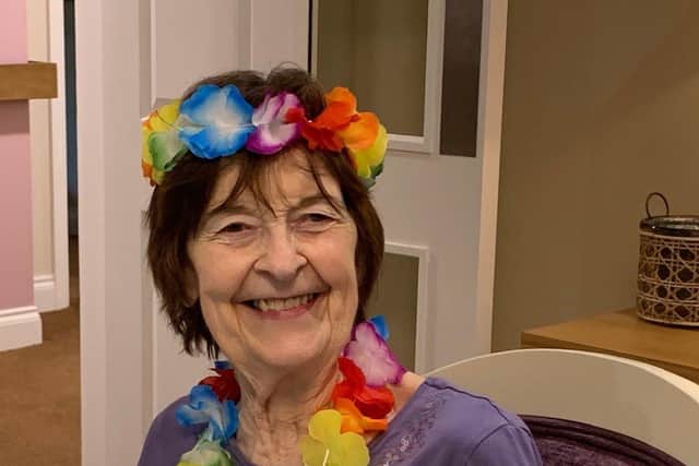 One of the residents, called Margaret, celebrates the Caribbean-themed party at Denmead Grange care home.