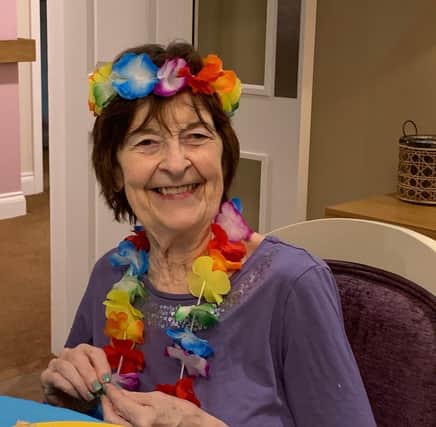 One of the residents, called Margaret, celebrates the Caribbean-themed party at Denmead Grange care home.