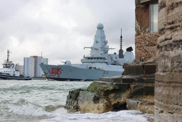 HMS Dragon leaving Portsmouth Harbour on her way to the eastern Mediterranean.