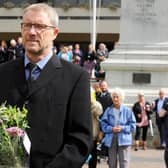 Editor of The News Mark Waldron joins mourners at a vigil to mark the passing of Queen Elizabeth II in Guildhall Square on Friday, September 9.
Picture: Sarah Standing (090922-333)