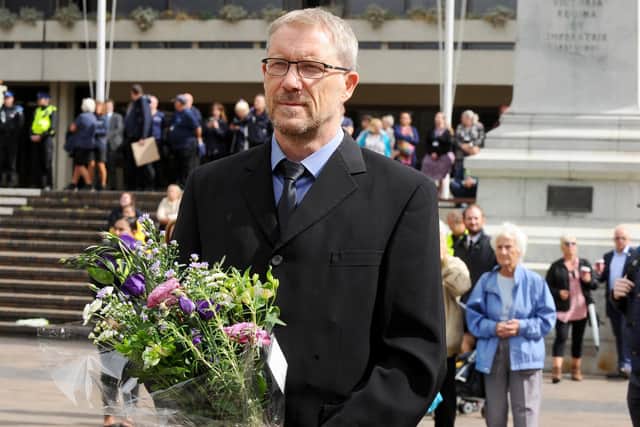 Editor of The News Mark Waldron joins mourners at a vigil to mark the passing of Queen Elizabeth II in Guildhall Square on Friday, September 9.
Picture: Sarah Standing (090922-333)