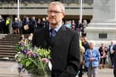 Editor of The News Mark Waldron joins mourners at a vigil to mark the passing of Queen Elizabeth II in Guildhall Square on Friday, September 9.
Picture: Sarah Standing (090922-333)