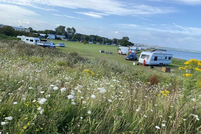 Travellers pictured at Milton Common on Thursday evening