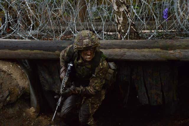 Reporter Tom Cotterill tackles a bayonet training course during his basic army reserve training at Pirbright. Photo: Cpl Callum Harris.