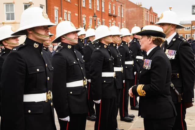 Pictured is: Rear Admiral Jude Terry chats with the Royal Marines
Picture: Keith Woodland (190621-145)