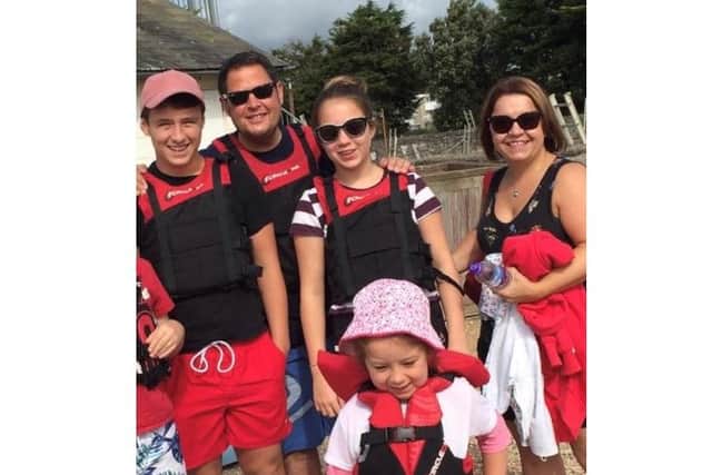 Simon Poole, a father of three (pictured at the back), was killed by Deividas Balkauskas, 41, at a pedestrian crossing.
