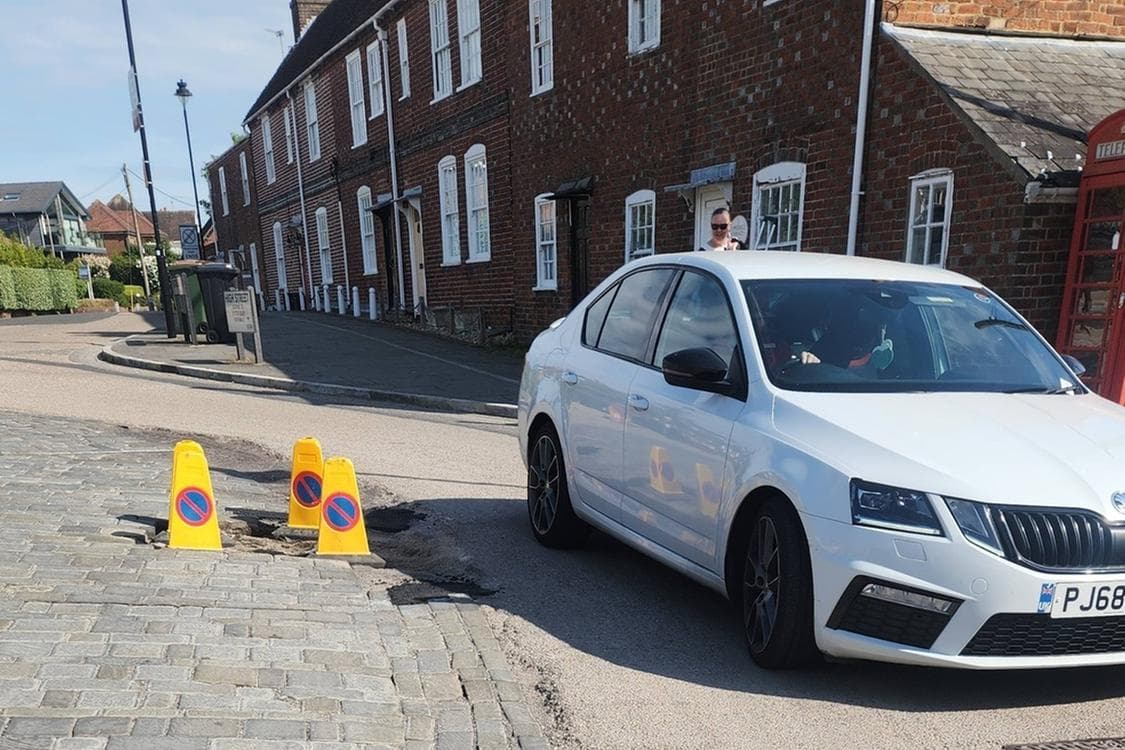 Potholes and botched repairs makes village look ‘neglected and tired’