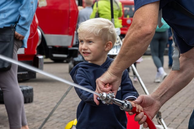 Walter Shute, 3, helps putting out fires at the Port Solent 999 Day.  Photos by Alex Shute