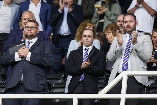 Phil Boardman, centre, alongside Pompey secretary Ally Knell, left, and sporting director Rich Hughes