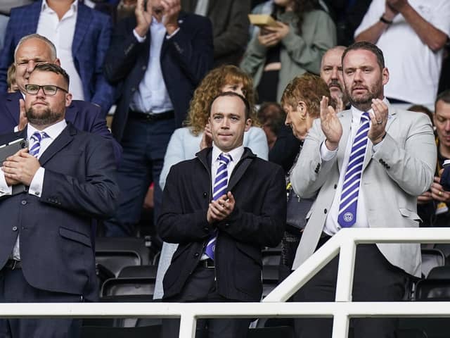 Phil Boardman, centre, alongside Pompey secretary Ally Knell, left, and sporting director Rich Hughes