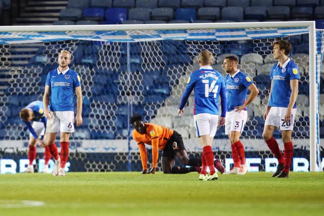 Jack Whatmough, left, looks dejected after he conceded a second-half penalty.