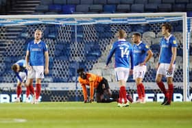 Jack Whatmough, left, looks dejected after he conceded a second-half penalty.