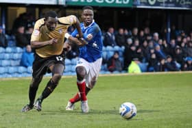 Sam Sodje tussles with Colchester's Jabo Ibehre on his Pompey debut at Fratton Park in February 2013. Picture: Barry Zee