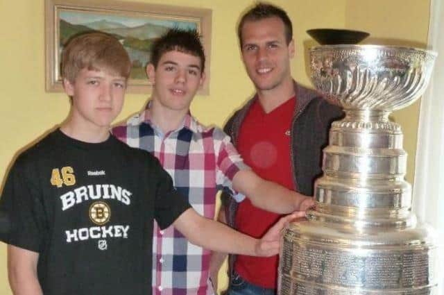 Danny Terry (centre) tragically lost his life after a fatal car crash on the A27. He's pictured with his friend Charlie and ice hockey player David Krejci