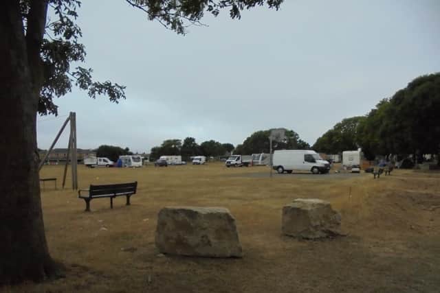 Travellers set up the illegal camp on Thursday after moving a defensive boulder, pictured front. Photo: Richard Coates