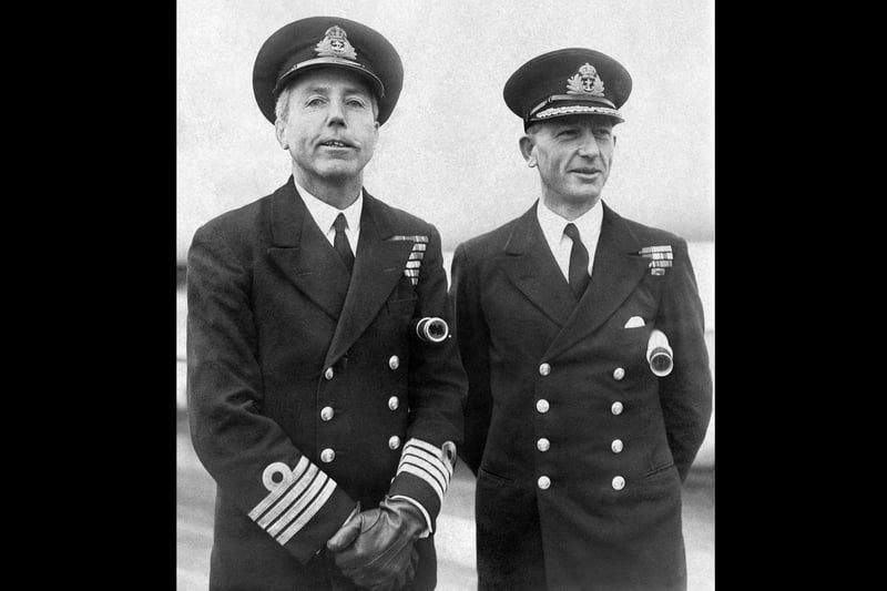 Rear-Admiral William Gladstone Agnew (1898 - 1960, left) and Commander W. J. Lamb of the Royal Navy aboard the battleship 'HMS Vanguard' at Portsmouth, UK, 29th January 1947. The 'Vanguard' would transport the royal family on their journey to South Africa later that year. (Photo by William Vanderson/Fox Photos/Hulton Archive/Getty Images)