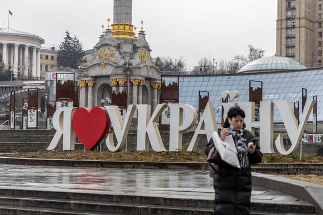 A woman walks through a near empty Independence Square on February 24, 2022 in Kyiv, Ukraine. Overnight, Russia began a large-scale attack on Ukraine, with explosions reported in multiple cities and far outside the restive eastern regions held by Russian-backed rebels. Picture: Chris McGrath/Getty Images