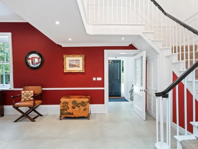 The listing says: "Set within grounds approaching one acre (incl. Bank) this incredible home of over 7,000 sq. Ft (inc outbuildings) provides flexible living accommodation for the discerning purchaser."