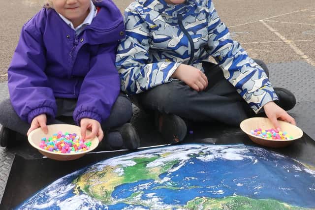 Two Liss schoolchildren with the new pop-up Portsmouth Cathedral. It was made by printing high-quality pictures of the real cathedral. Picture: Portsmouth Diocese