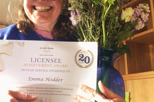 Emma Hodder with her 20 year service award certificate