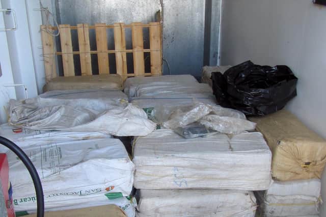 Drugs being offloaded from the US Coast Guard cutter Bear in San Juan, Puerto Rico, as well as the go-fast and the drugs being seized by Mounts Bay.
