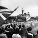HMS Hermes returning to a frenzied Portsmouth Harbour in 1982, post-Falklands war.