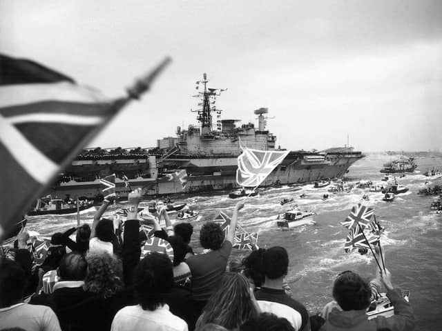 HMS Hermes returning to a frenzied Portsmouth Harbour in 1982, post-Falklands war.