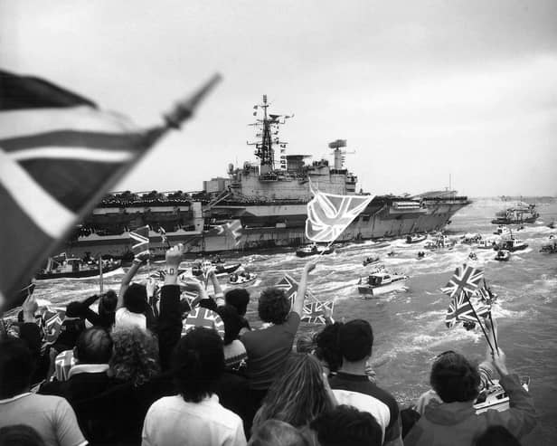 HMS Hermes returning to a frenzied Portsmouth Harbour in 1982, post-Falklands war.