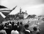 HMS Hermes returning to a frenzied Portsmouth Harbour in 1982, post-Falklands war.