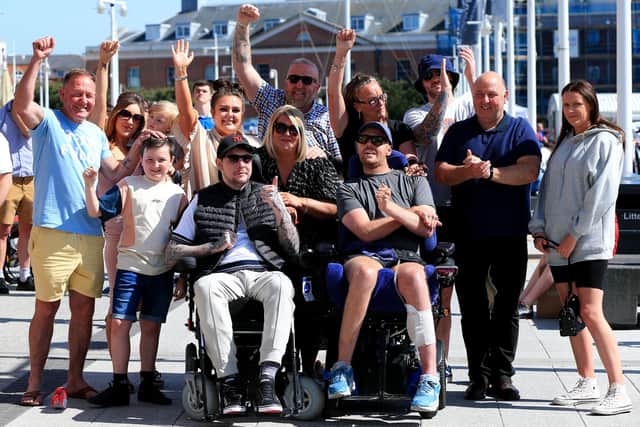 Josh Henwood-Evans, sitting front left, and Jack Farrugia, sitting front right, with families, friends and well-wishers after the event. Picture: Chris Moorhouse (jpns 140522-28)